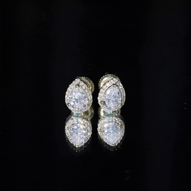 Rosec Jewels certified 5x7 mm cubic zirconia halo stud earrings with sparkling white stones on silver setting.