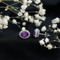 Oval amethyst stud earrings with moissanite halo, featuring Rosec Jewels' elegant and sparkling jewelry design.
