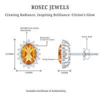 Natural 6x8mm oval citrine stud earrings with halo setting from Rosec Jewels, showcasing sparkling yellow-orange gemstones.