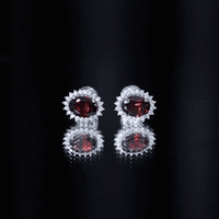 Yellow 3-carat garnet oval stud earrings with moissanite halo from Rosec Jewels, showcasing sparkling gemstone and elegant design.