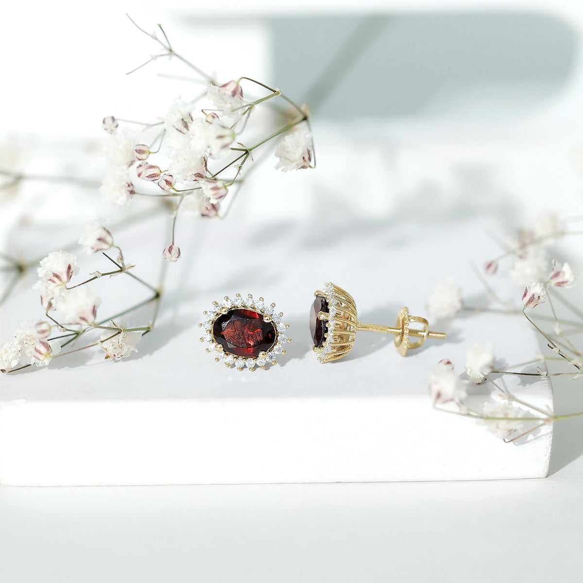 3 carat garnet oval stud earrings with moissanite halo from Rosec Jewels, featuring vibrant red gemstones and sparkling surrounding stones.