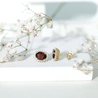 3 carat garnet oval stud earrings with moissanite halo from Rosec Jewels, featuring vibrant red gemstones and sparkling surrounding stones.