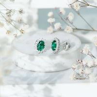 Lab Created Emerald Oval Stud Earrings with Moissanite Halo