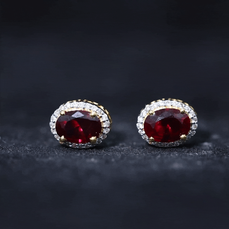 Lab created ruby and diamond halo stud earrings featuring yellow gold settings, designed by Rosec Jewels.