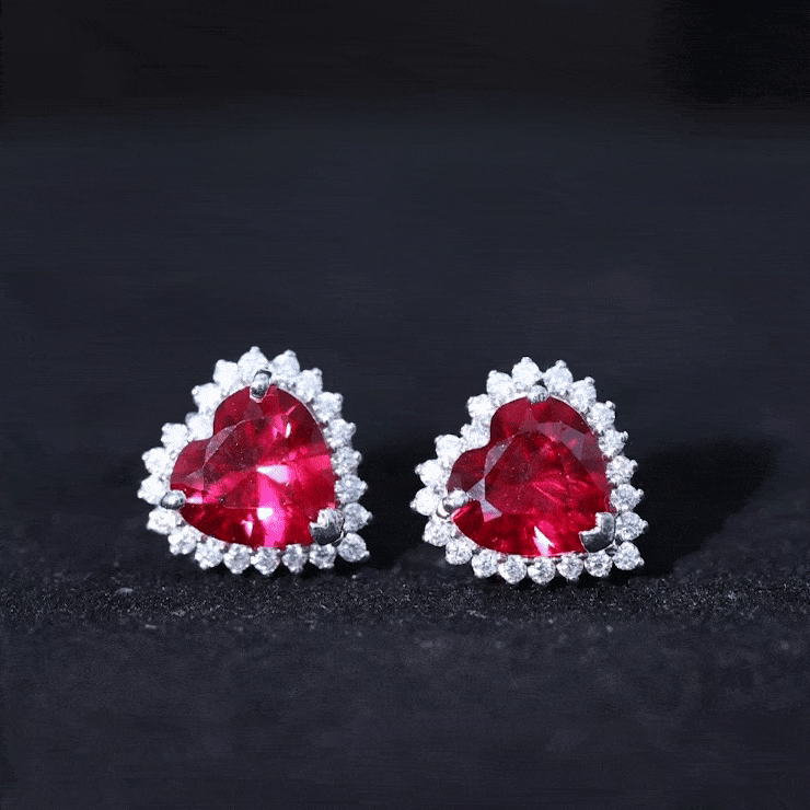 Rosec Jewels lab-created ruby heart stud earrings with diamond halo, showcasing vibrant red rubies and sparkling diamonds.