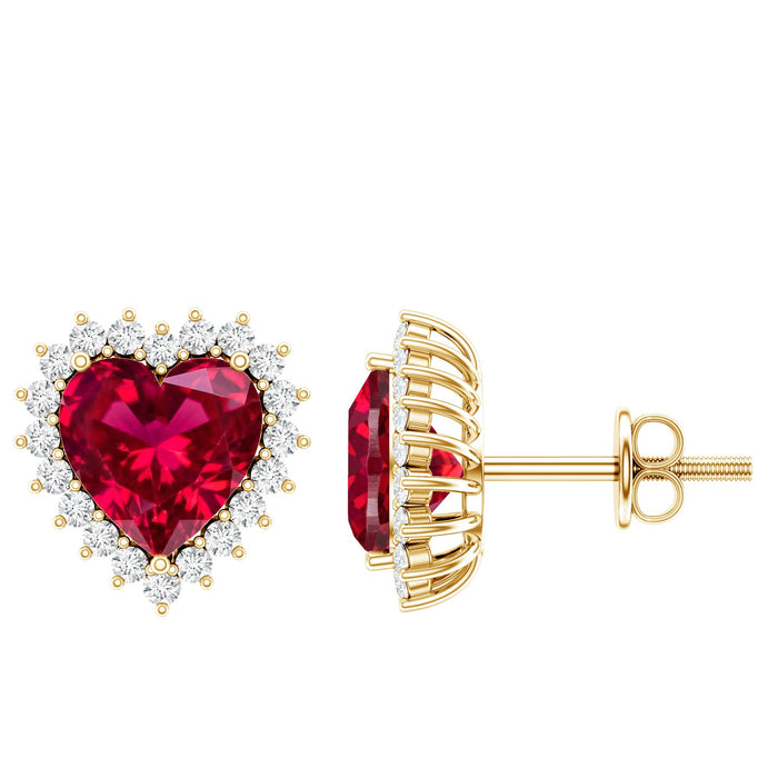 Lab-created ruby heart stud earrings with diamond halo by Rosec Jewels, featuring vibrant red gemstones and sparkling accents.