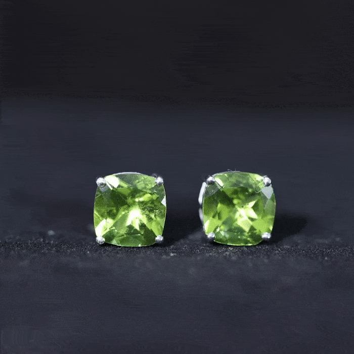 Genuine cushion cut peridot solitaire stud earrings by Rosec Jewels, showcasing sparkling green gemstones with certificate.
