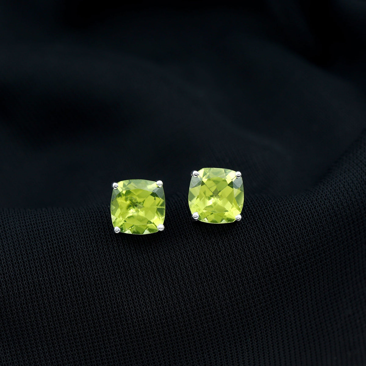 Genuine cushion cut peridot solitaire stud earrings by Rosec Jewels with certification, featuring vibrant green gemstones and classic design.