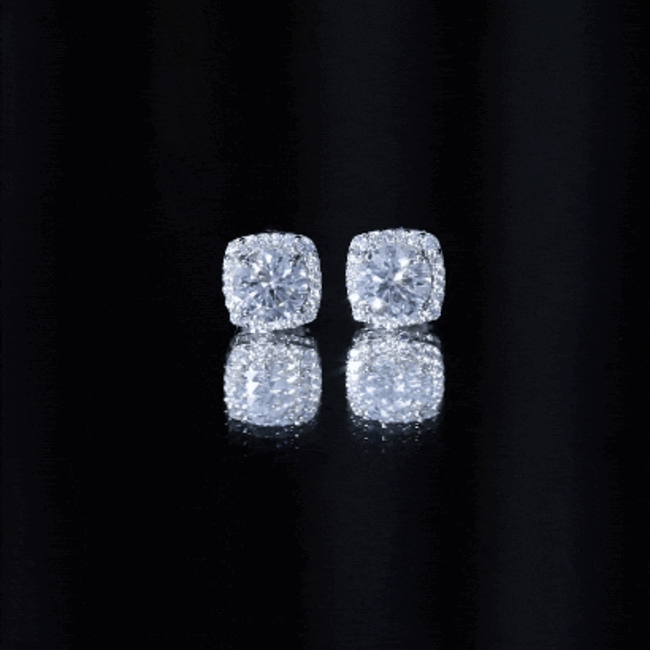 Round cut moissanite halo stud earrings by Rosec Jewels featuring sparkling yellow moissanite stones and classic earring design.