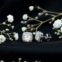 Round cut moissanite halo stud earrings by Rosec Jewels featuring sparkling gemstone accents and a classic earring design.