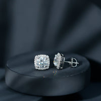 Round cut moissanite halo stud earrings by Rosec Jewels featuring classic design and sparkling gemstone accents.