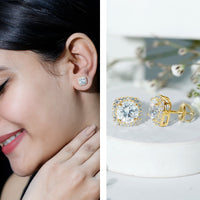 Round cut moissanite halo stud earrings by Rosec Jewels featuring sparkling moissanite stones and a classic halo design.