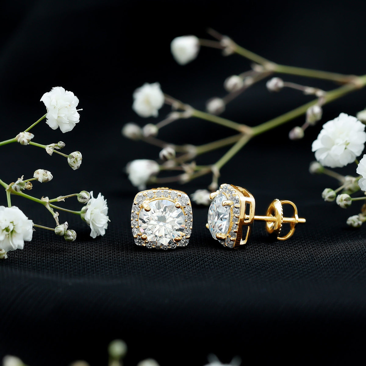 Round cut moissanite halo stud earrings by Rosec Jewels featuring sparkling stones and a classic, elegant design.
