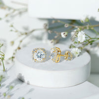 Round cut moissanite halo stud earrings by Rosec Jewels featuring classic design and sparkling gemstone accents.