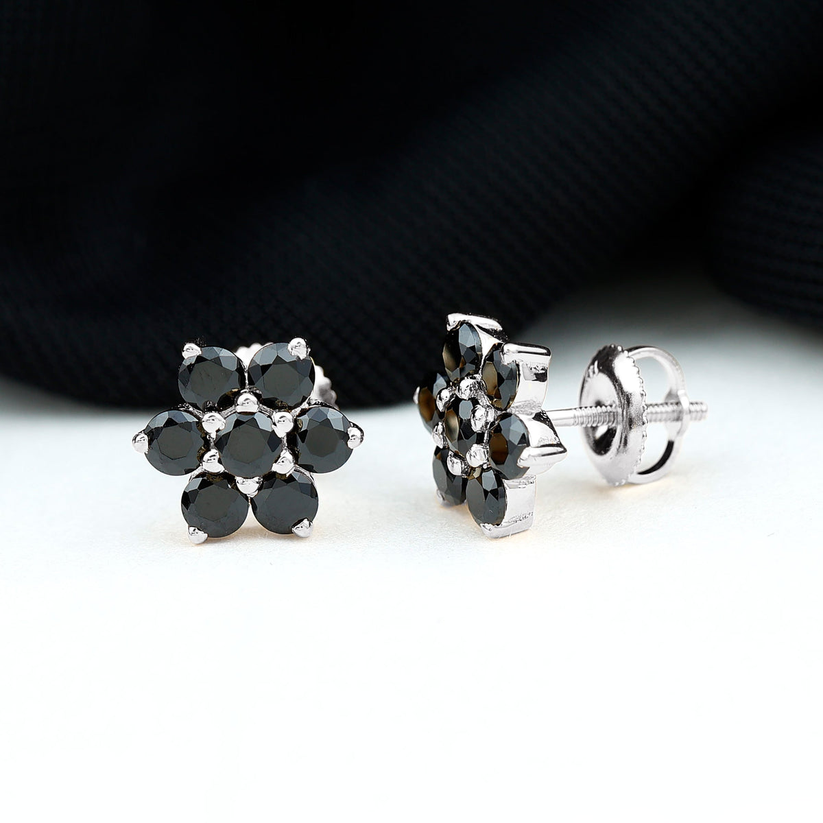 Natural black spinel floral cluster stud earrings by Rosec Jewels, showcasing intricate floral design and sparkling black spinel gemstones.