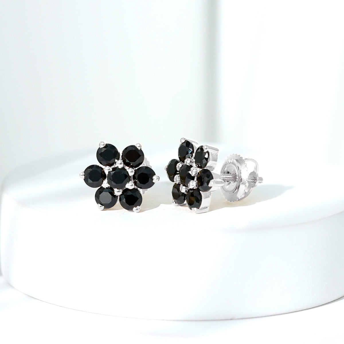 Natural black spinel floral cluster stud earrings by Rosec Jewels featuring sparkling black spinel stones and intricate floral design.