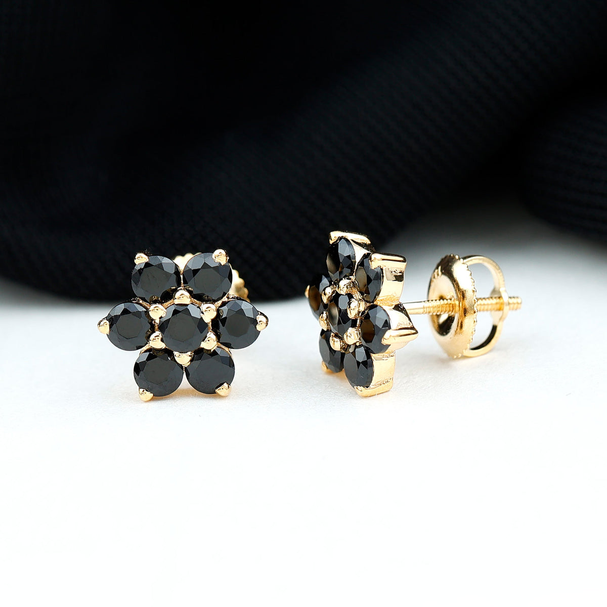 Natural black spinel floral cluster stud earrings by Rosec Jewels featuring intricate flower-shaped black spinel stones.
