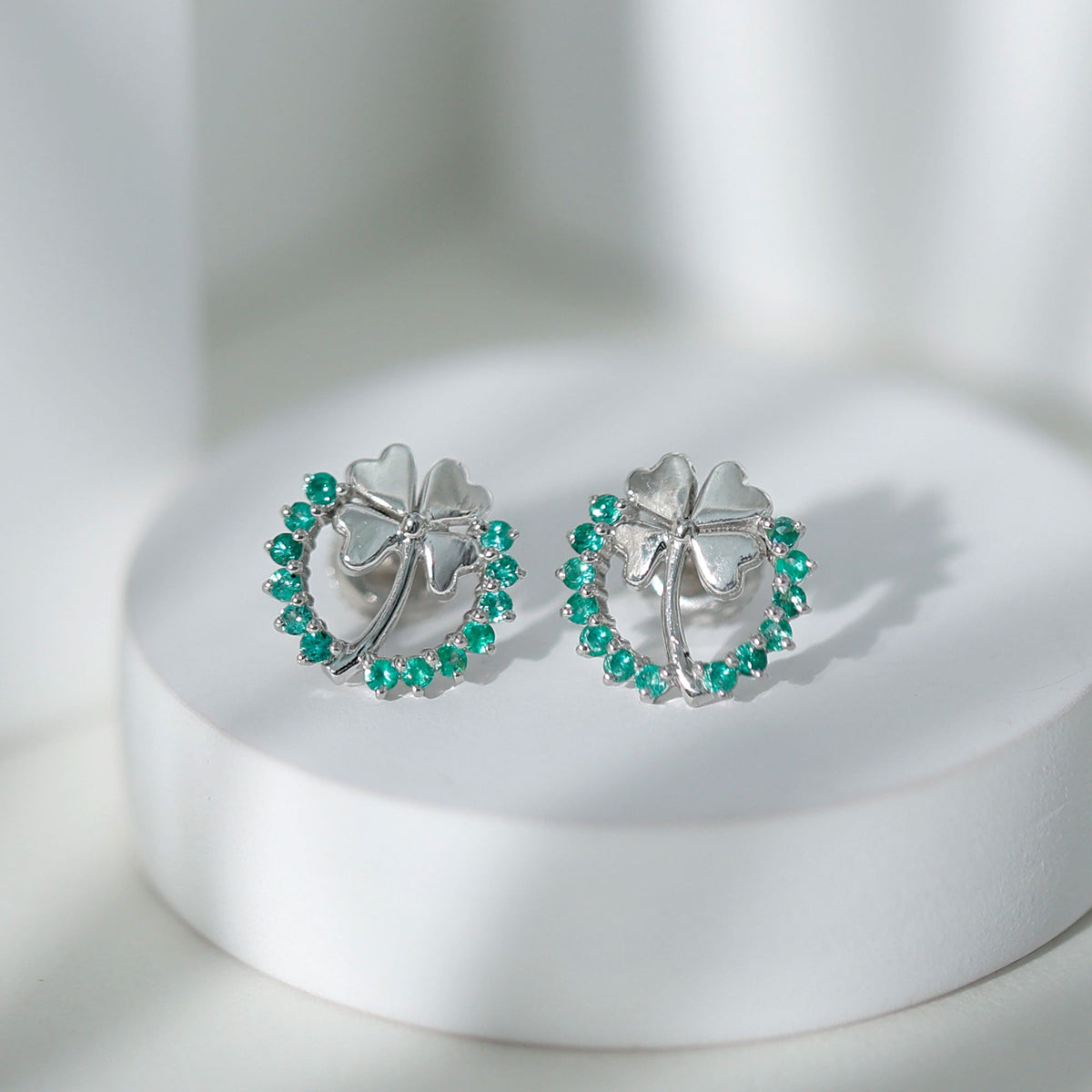 Genuine emerald clover stud earrings for women by Rosec Jewels, featuring four-leaf clover design with sparkling emerald stones.