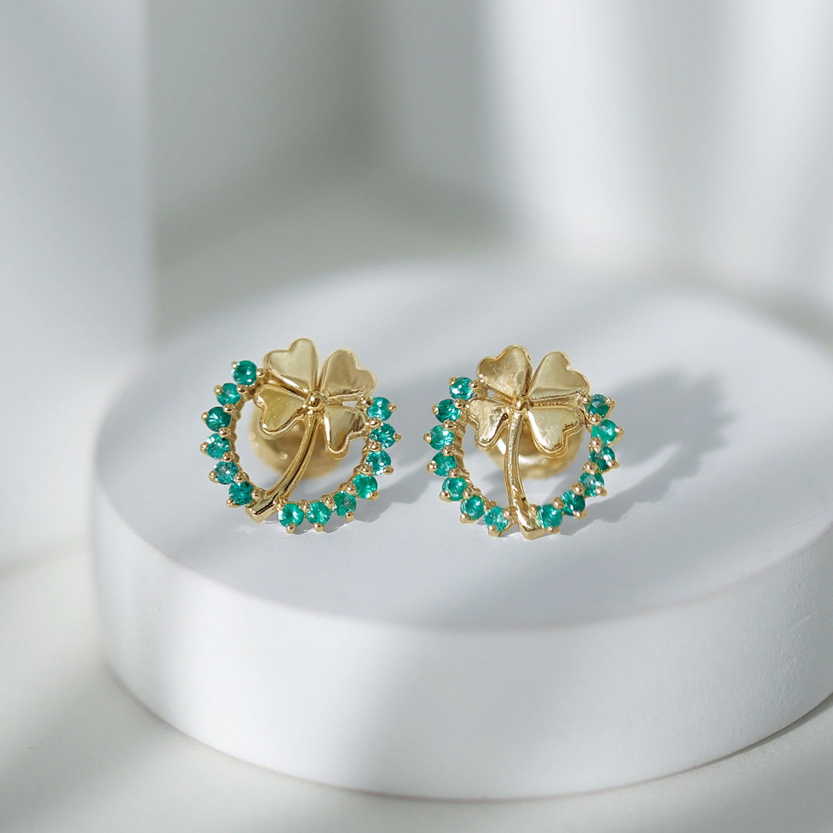 Genuine emerald clover stud earrings for women by Rosec Jewels, featuring sparkling green gemstone design.