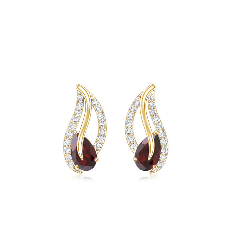 Pear shape garnet and diamond leaf stud earrings from Rosec Jewels with gold settings, featuring elegant gemstone and diamond details.
