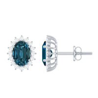 Oval cut London Blue Topaz and diamond stud earrings with a starburst design by Rosec Jewels.