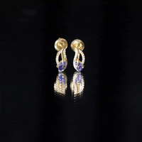 Pear-shaped tanzanite and diamond leaf stud earrings featuring elegant gemstone and metal details by Rosec Jewels.