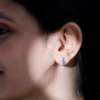 Pear-shaped tanzanite and diamond leaf stud earrings by Rosec Jewels featuring elegant gemstone and sparkling diamond accents.