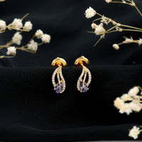 Pear-shaped tanzanite and diamond leaf stud earrings in gold, featuring elegant, nature-inspired design by Rosec Jewels.