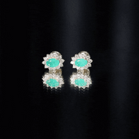 Natural 0.8 carat oval cut emerald and diamond earrings by Rosec Jewels, featuring green emeralds and sparkling diamonds.