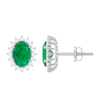 Natural 0.8 carat oval cut emerald and diamond earrings by Rosec Jewels featuring elegant gemstone and sparkling diamond accents.