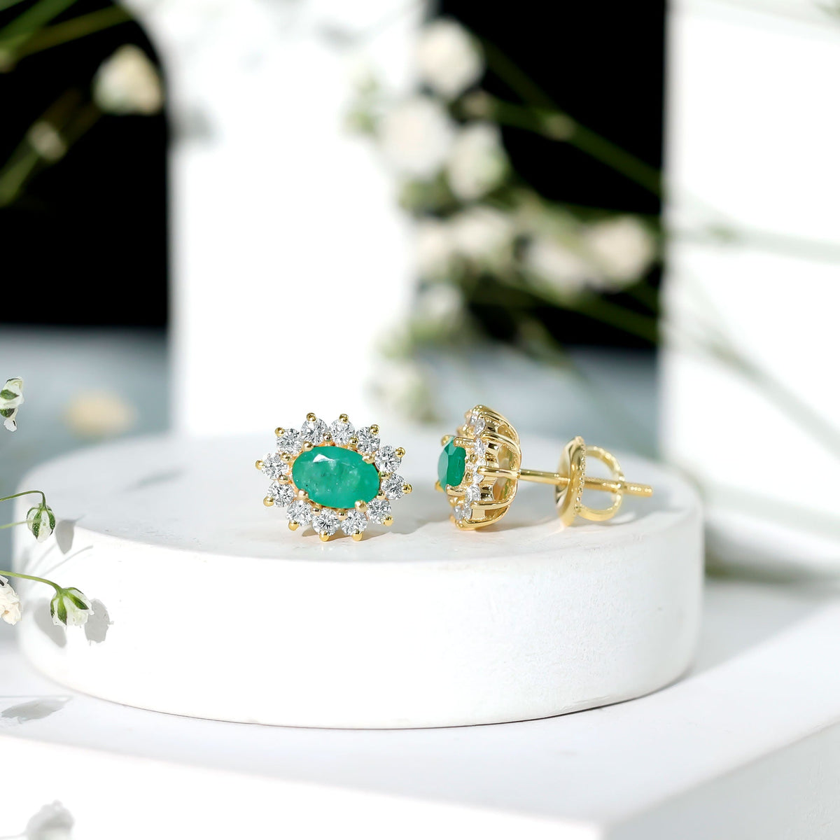 Natural 0.8 carat oval cut emerald and diamond earrings by Rosec Jewels featuring elegant gemstone and sparkle settings.