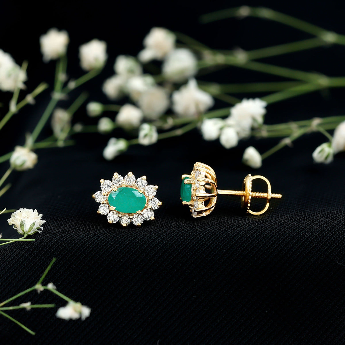 Natural 0.8 carat oval cut emerald and diamond earrings by Rosec Jewels, featuring lush green emeralds and sparkling diamonds.