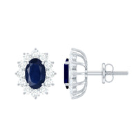 Classic blue sapphire stud earrings with diamond halo from Rosec Jewels, featuring sparkling sapphires and a shimmering diamond surround.