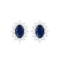 Rosec Jewels classic blue sapphire stud earrings with diamond halo, featuring sparkling blue sapphires and elegant diamond accents.