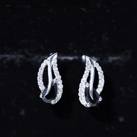 Pear-shaped black spinel and diamond leaf stud earrings from Rosec Jewels, featuring elegant jewelry design and fine craftsmanship.