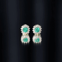 Yellow gold classic emerald stud earrings with diamond halo by Rosec Jewels, featuring vibrant green emeralds and sparkling diamonds.