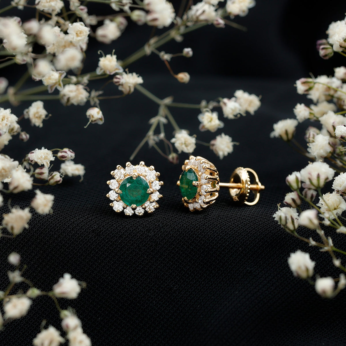 Rosec Jewels classic emerald stud earrings with diamond halo, featuring vibrant emerald gemstones and sparkling diamond accents.