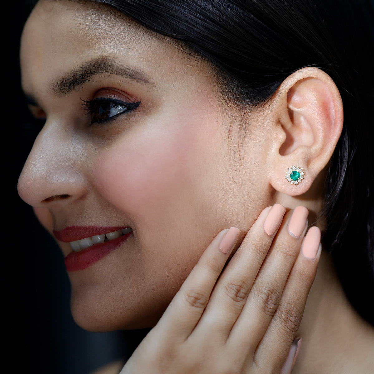 Rosec Jewels classic emerald stud earrings with diamond halo, showcasing sparkling emerald gemstones and elegant design.