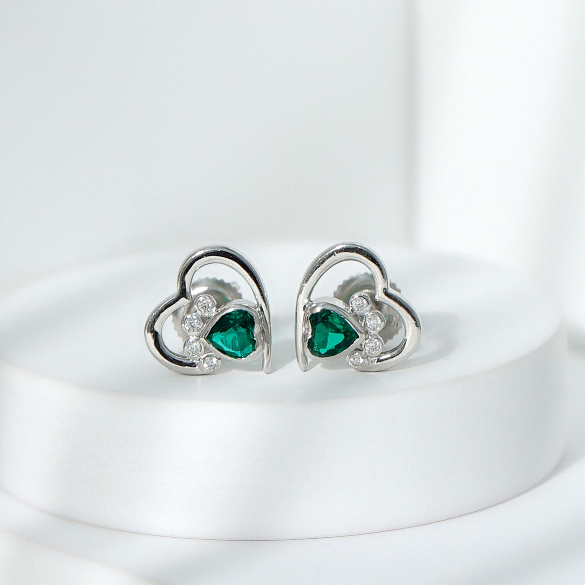 Lab-created emerald and moissanite heart paw stud earrings by Rosec Jewels, featuring detailed gemstone designs.