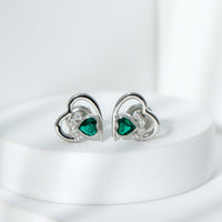 Lab-created emerald and moissanite heart paw stud earrings by Rosec Jewels, featuring detailed gemstone designs.