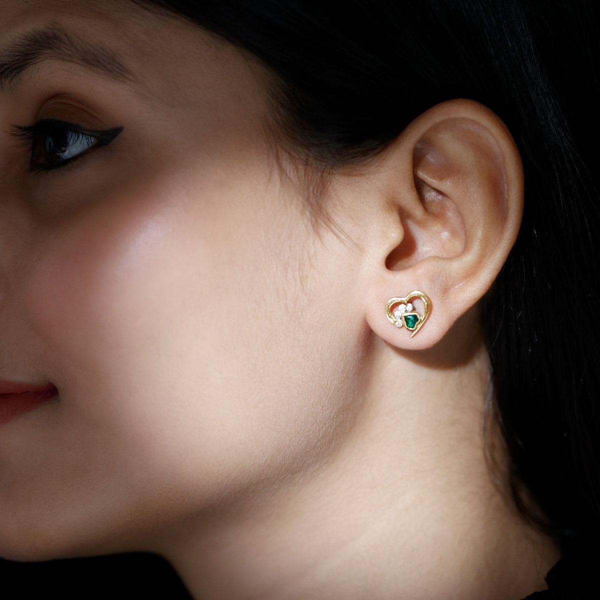 Lab-created emerald and moissanite heart paw stud earrings by Rosec Jewels featuring sparkling gemstone accents on silver stud settings.