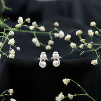 Natural freshwater pearl snowman stud earrings by Rosec Jewels featuring white pearl snowman designs on sterling silver posts