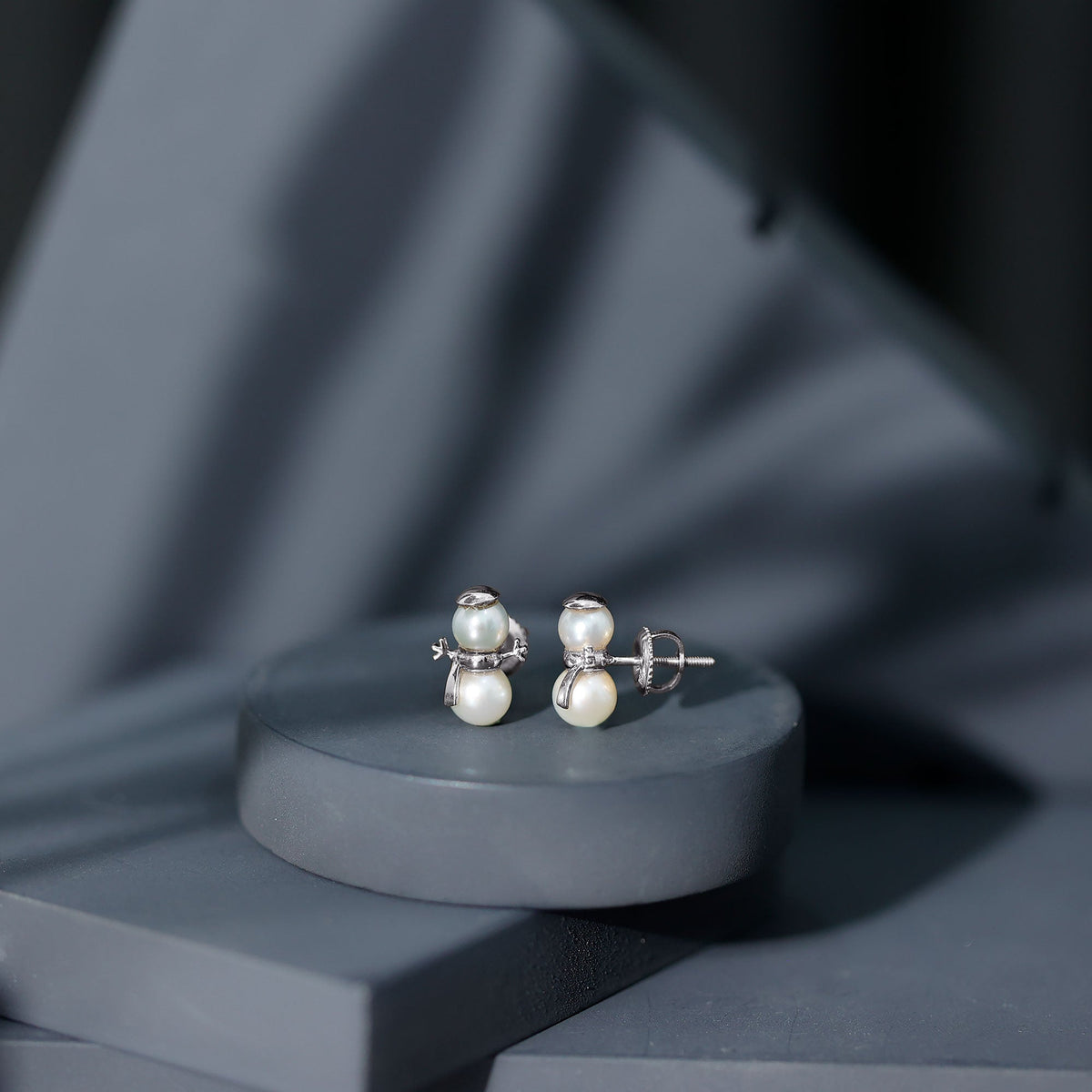 Natural freshwater pearl snowman stud earrings by Rosec Jewels, featuring elegant white pearl snowman design on silver studs.
