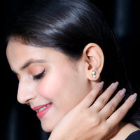 Freshwater pearl snowman stud earrings by Rosec Jewels, featuring delicate white pearls shaped like snowmen on sterling silver studs.