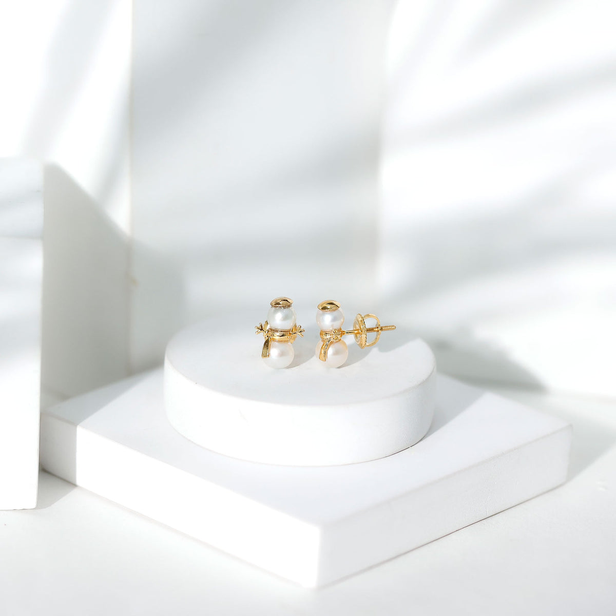 Freshwater pearl snowman stud earrings by Rosec Jewels featuring delicate white pearls and silver accents.