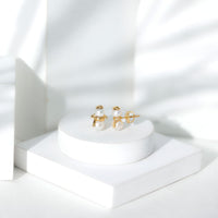 Freshwater pearl snowman stud earrings by Rosec Jewels featuring delicate white pearls and silver accents.