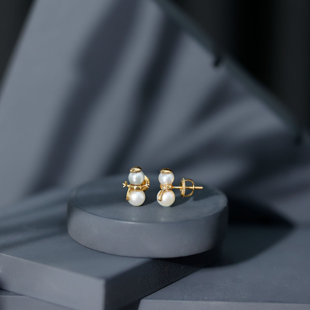 Natural freshwater pearl snowman stud earrings by Rosec Jewels featuring delicate pearl snowman design on sterling silver posts.