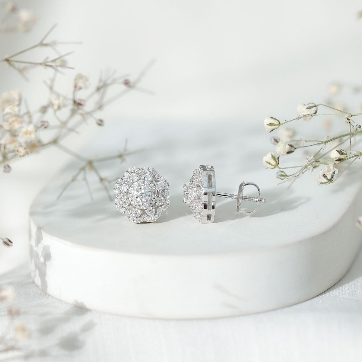 Rosec Jewels Certified Moissanite Big Flower Stud Earrings showcasing sparkling flower-shaped earrings in a close-up shot.