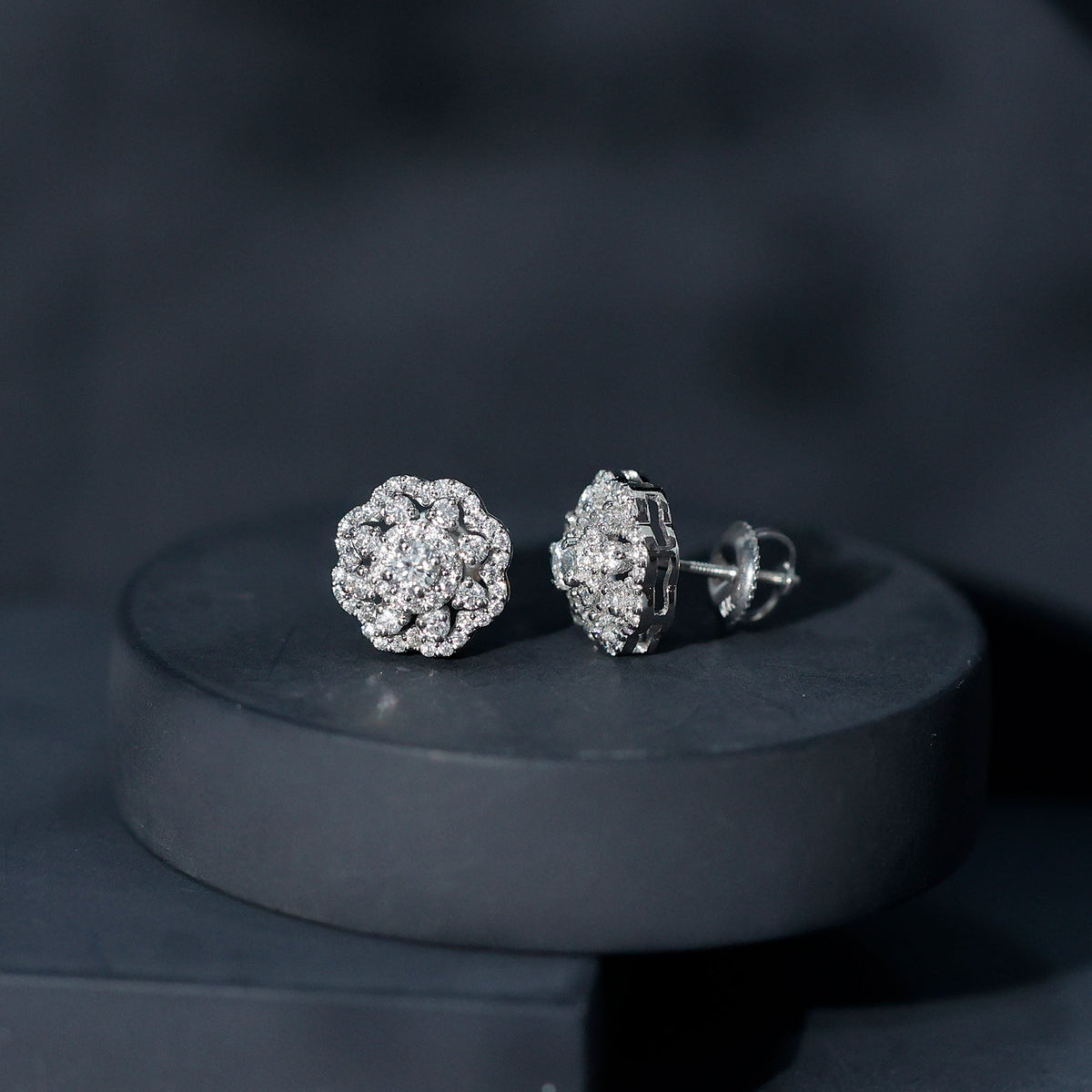 Rosec Jewels certified moissanite big flower stud earrings with sparkling gemstone design on a white background.