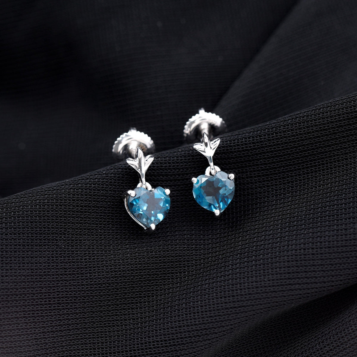 Four-carat London Blue Topaz heart drop earrings for women featuring elegant sterling silver settings by Rosec Jewels.